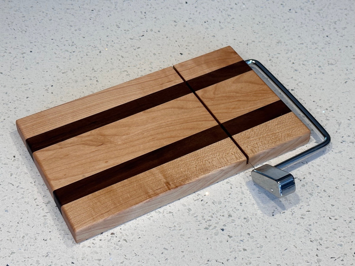 Cheese slicer. Available in cherry , walnut and maple.